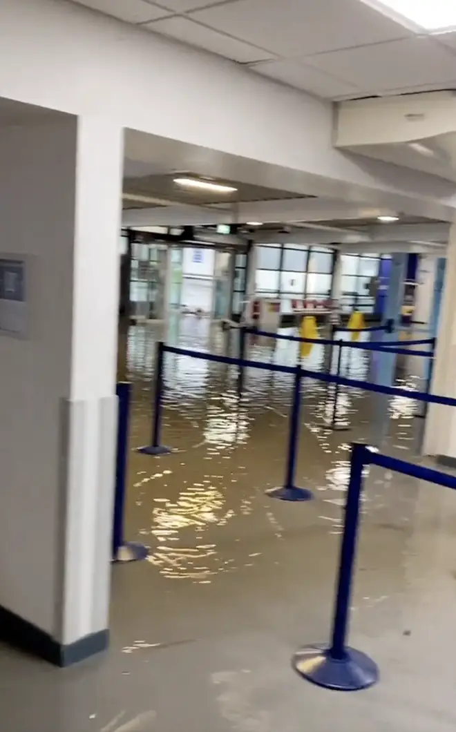 Water could be seen surrounding luggage carousels as airport workers surveyed the scene.