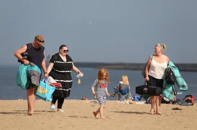 Sunbathers look for a spot to settle on the beach on September 9, 2023 in South Shields, England.