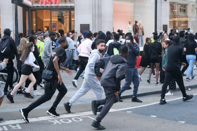 Police and large groups of young people in Oxford Circus hours after the mass TikTok crime was due to take place.