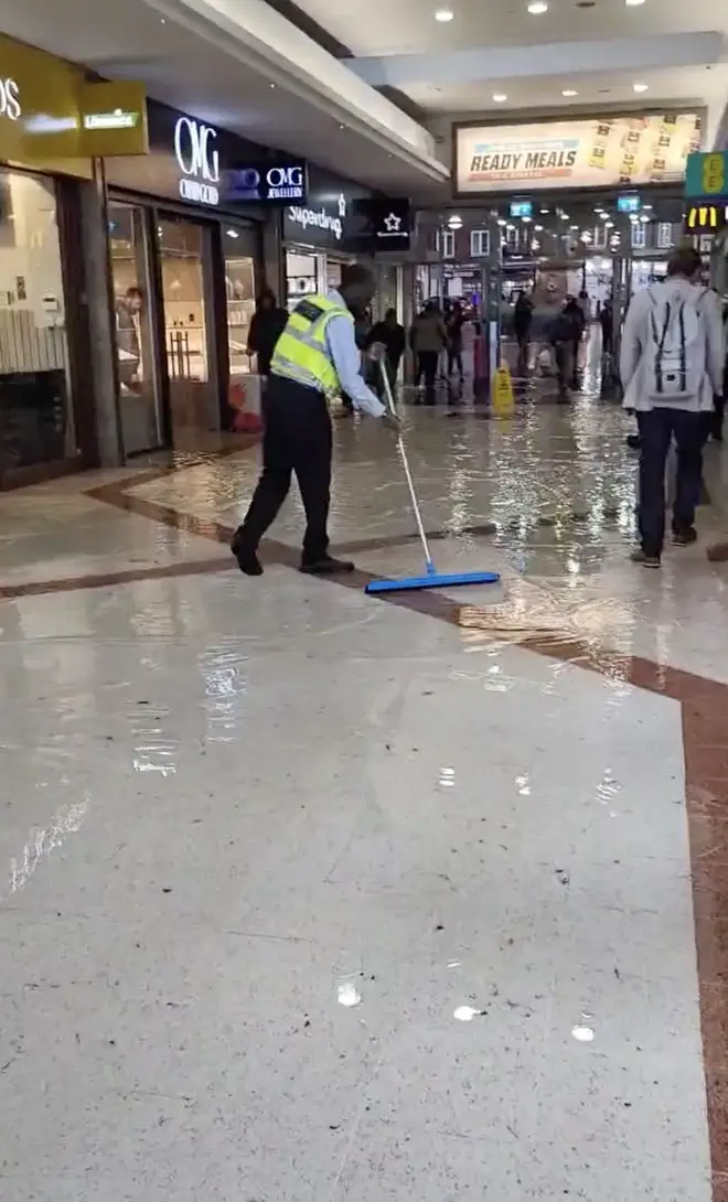 Footage showed a Stratford shopping centre flooded indoors.