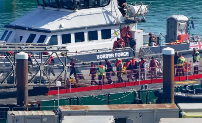 Migrants being brought ashore in Dover earlier this month