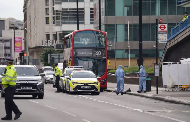 Investigators at the scene of the stabbing in Croydon