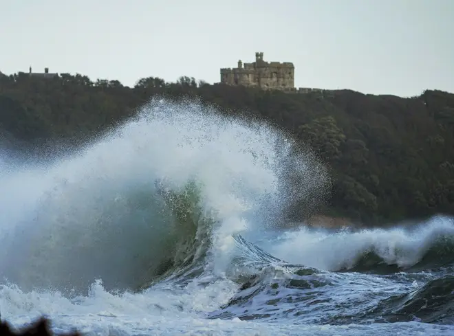 Large waves reach the shoreline near Pendennis Castle at Gylllyngvase Beach