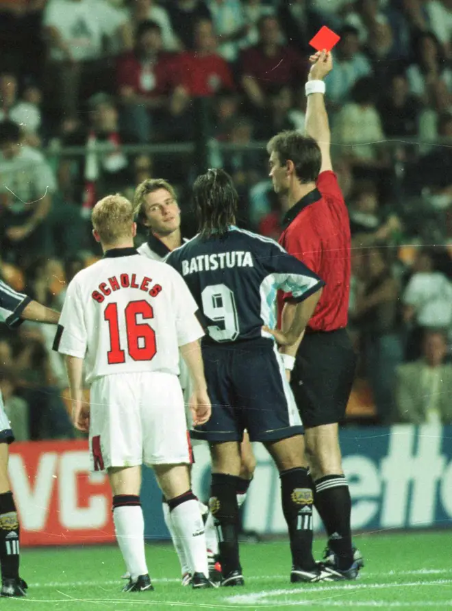 David Beckham was given a red card for kicking a player on the opposition team, Diego Simeone.