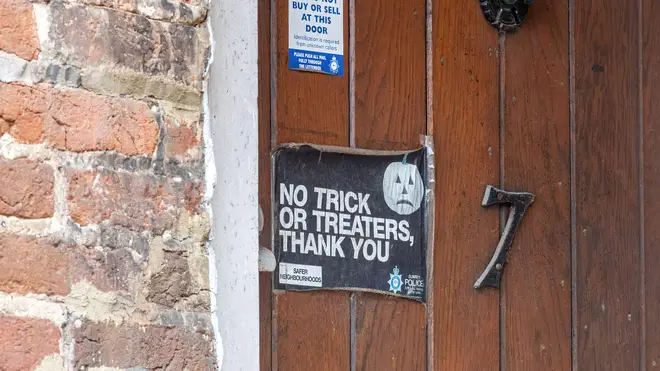 No Trick-or-Treaters sign.