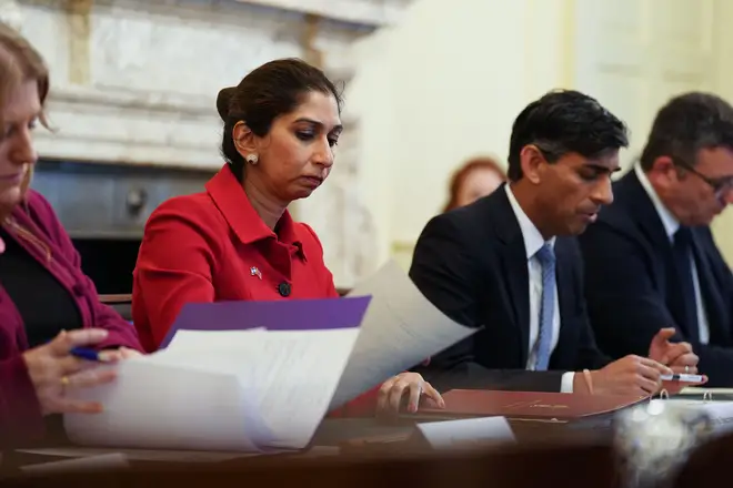 Britain's Prime Minister Rishi Sunak (R) and Britain's Home Secretary Suella Braverman attend a policing roundtable summit at 10 Downing Street