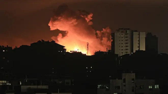Fire and smoke rise above buildings in Gaza City