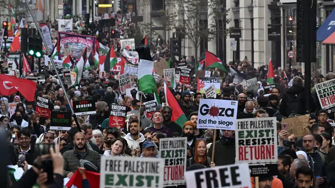 People walk down Regent Street as they take part in a 'March For Palestine'