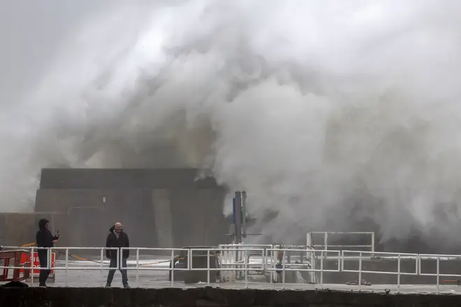 Waves crash over the harbour on October 19, 2023 in Stonehaven, Scotland