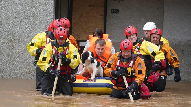 Members of the emergency services help local residents to safety in Brechin