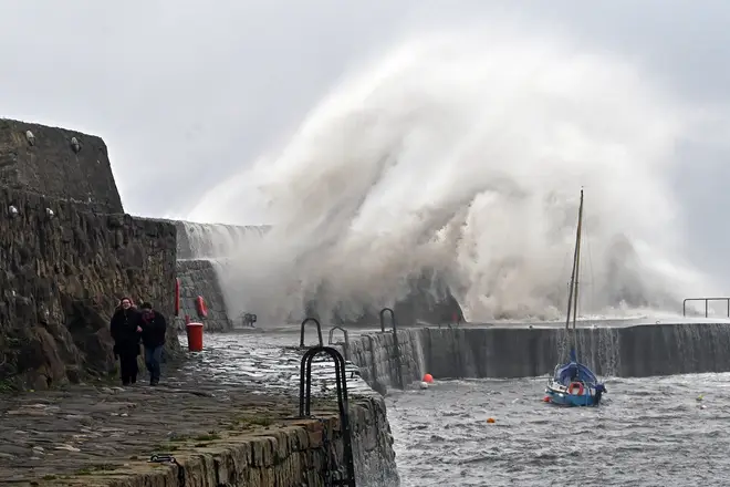Waves break over Dysart harbour wall during storm Babet