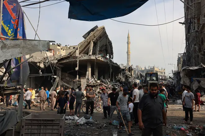 People gather amid the destruction in Gaza City