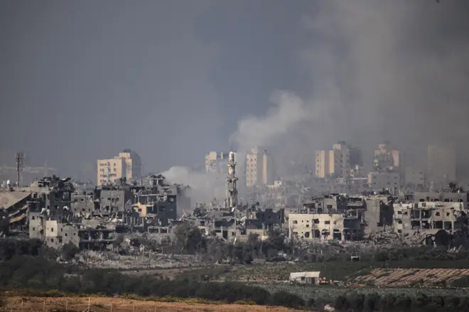 Smoke rises amid destroyed buildings in Gaza