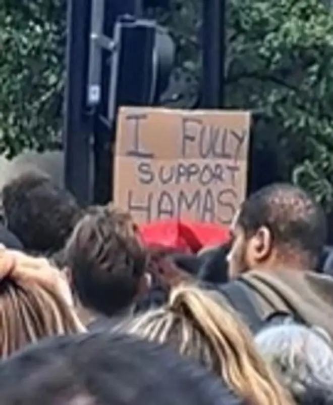 Police are also looking to find this man who waved a pro-Hamas sign.