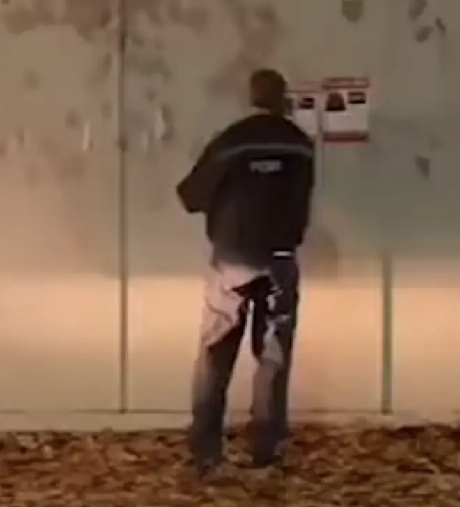 A lone police officer was filmed pulling down posters of Israeli hostages in Prestwich