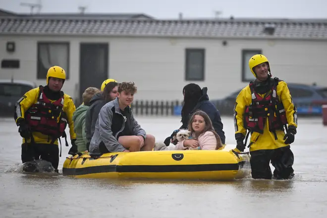 People are rescued from their holiday chalets by fire and rescue at Freshwater Beach Holiday Park in Burton Bradstock, Dorset