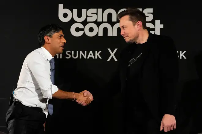 Britain's Prime Minister Rishi Sunak (L) shakes hands with X (formerly Twitter) CEO Elon Musk
