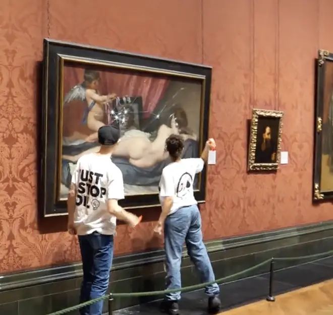 The pair smashed the glass protecting the painting.