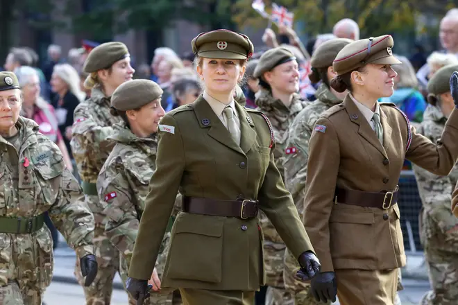 Military personnel march during the parade of the Lord Mayor.