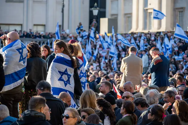 Protesters wave Israeli flags during the demonstration in Trafalgar Square in London