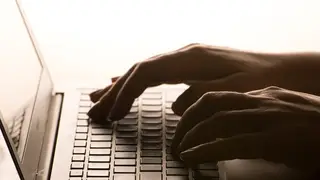 Woman uses laptop