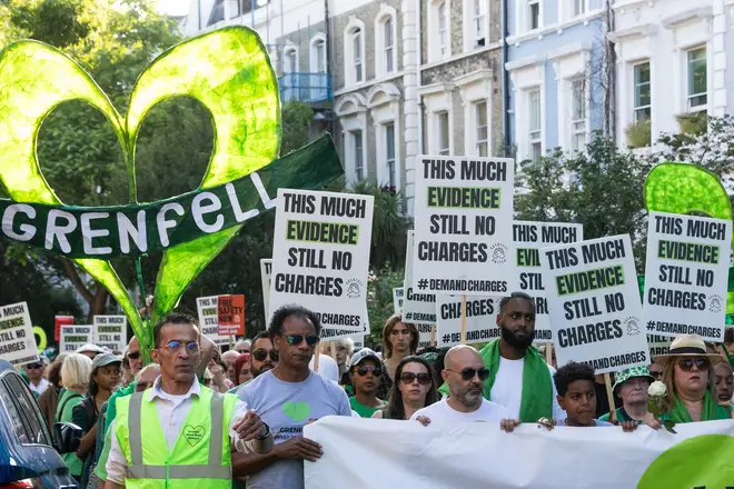 Members of the Grenfell community and supporters take part in the Grenfell Silent Walk around West Kensington on 14 June 2023