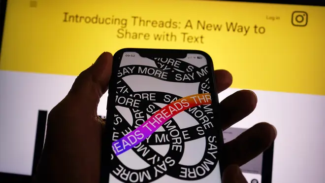 An Apple iPhone screen showing the Threads app