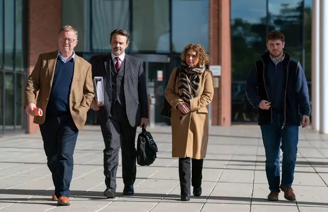 Hannah Ingram-Moore with husband Colin (left) and son Benjie (right), at Central Bedfordshire Council for a hearing to appeal against an order to demolish the unauthorised spa pool