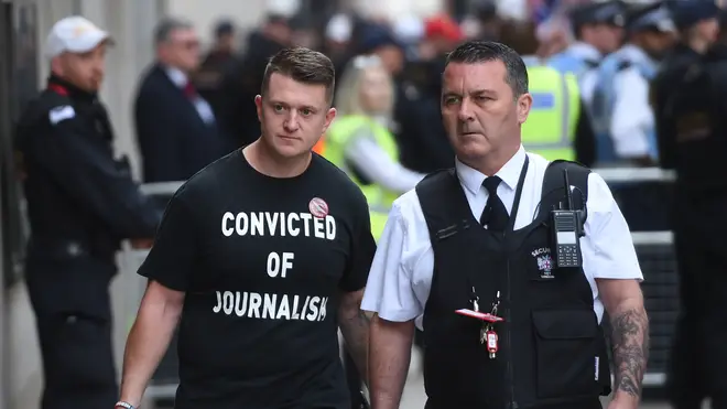 Tommy Robinson arrives in court with a t-shirt reading "Convicted of journalism"