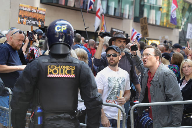 Angry protesters were met with riot police outside the Old Bailey