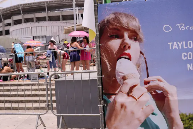 Taylor Swift fans wait for the doors of Nilton Santos Olympic stadium to open for her Eras Tour concert amid a heat wave in Rio de Janeiro