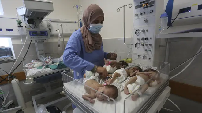 A nurse cares for premature Palestinian babies moved from Shifa Hospital in Gaza City to the hospital in Rafah on Sunday
