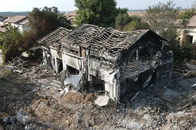 An aerial picture shows a damaged building in kibbutz Beeri near the border with Gaza