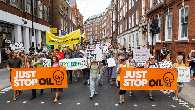 Just Stop Oil and Extinction Rebellion march from Parliament Square to the Home Office against the possible deportation of Marcus Decker from the UK. Credit: Andrea Domeniconi/Alamy News