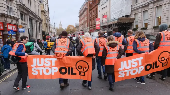 Just Stop Oil protesters march from Trafalgar Square to the top of Whitehall where they start to protest and are arrested. Credit: Matthew Chattle/Alamy Live News
