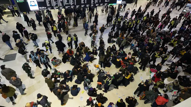 Police officers remove pro-Palestinian protesters that took part in a sit-in demonstration at London's Waterloo Station calling for a ceasefire in Gaza. Picture date: Saturday November 18, 2023.