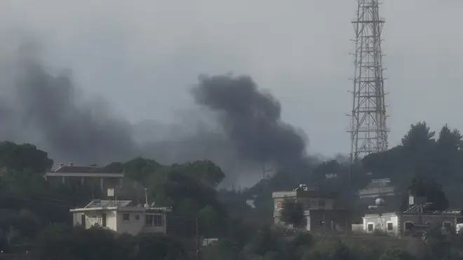 Black smoke rises from an Israeli army position