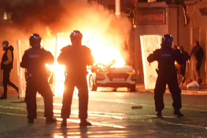 A police vehicle was torched in the riot