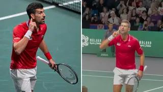 Djokovic gestures to a noisy section of British fans in the crowd