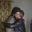 Fahad Shah hugs a colleague after his release