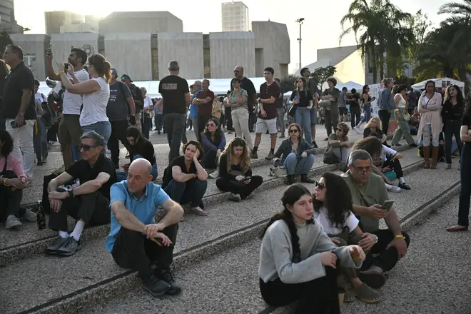 Families of the hostages take part in a Shabbat prayer service in Tel Aviv ahead of some being released
