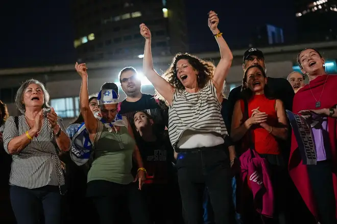 People in Tel Aviv celebrate the news of the release of 13 Israeli hostages held by Hamas in the Gaza strip,