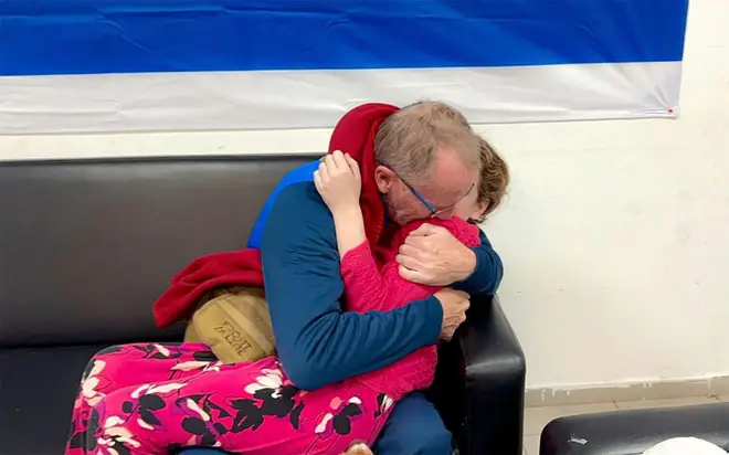 Emily Hand is reunited with her father after seven weeks in captivity