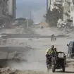 Palestinians drive through Gaza City