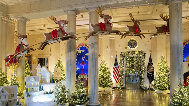Holiday decorations adorn the Grand Foyer of the White House for the 2023 theme Magic, Wonder and Joy