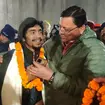 Pushkar Singh Dhami, right, chief minister of the state of Uttarakhand, greeting a worker rescued from the site of an under-construction road tunnel that collapsed in Silkyara in the northern Indian s