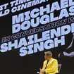 Hollywood actor and producer Michael Douglas speaks to Indian film producer Shailendra Singh at a session on the last day of the 54th International Film Festival of India, in Goa