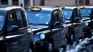 A line of black cabs in London