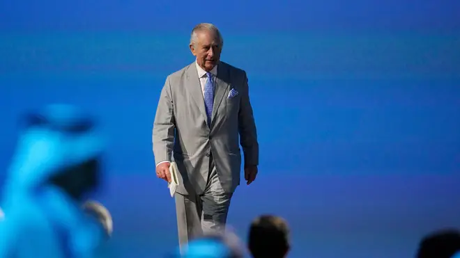 King Charles III walks during the opening ceremony at the COP28 U.N. Climate Summit, Friday, Dec. 1, 2023, in Dubai, United Arab Emirates. (AP Photo/Rafiq Maqbool)