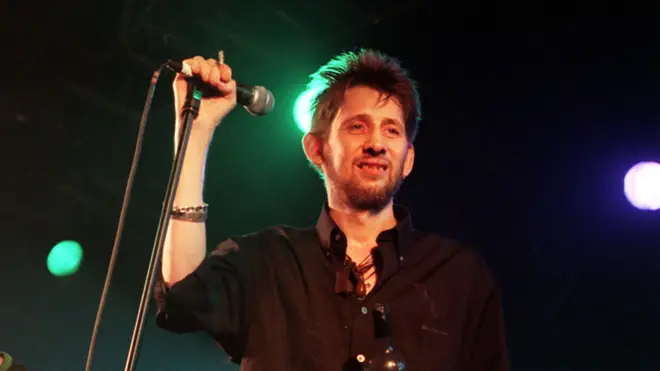 Shane MacGowan performs on stage with his group The Popes, at the 10th annual Fleadh, in Finsbury Park